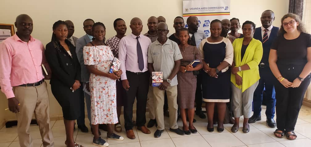 Uganda AIDS Commission officials with district officials and other stakeholders posing for a photo.